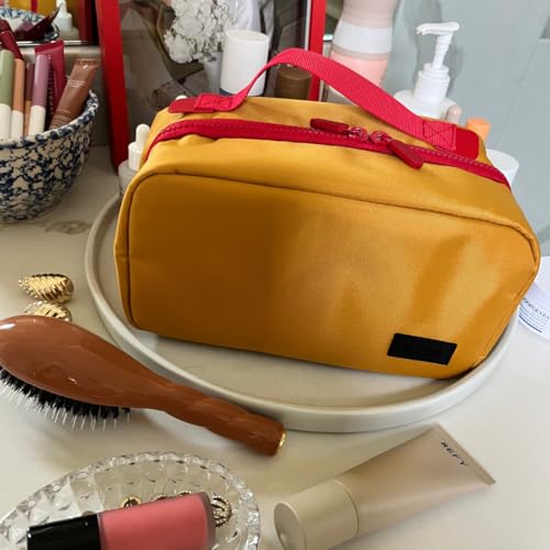 Cincha Toiletry Bag for Travel ? Spill-Resistant Dopp Kit with Multiple Compartments, Opens Flat for Easy Access ? Durable, Stylish Organizer for Men & Women (Marigold)