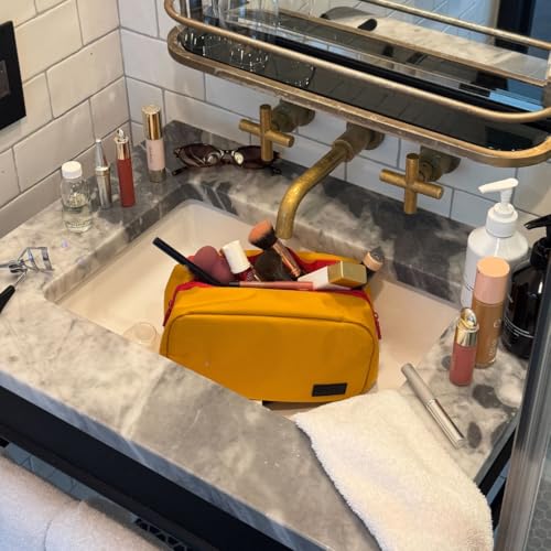 Cincha Toiletry Bag for Travel ? Spill-Resistant Dopp Kit with Multiple Compartments, Opens Flat for Easy Access ? Durable, Stylish Organizer for Men & Women (Marigold)