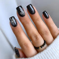 Christmas Black Press on Nails Short Square Fake Nails with White Snowflake Starry Night Designs Glossy Coffin False Nails Cute Glue on Nails Holiday Artificial Stick on Nails for Women Girls 24Pcs